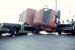 Trash truck crushes car