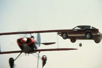 Caddy Flys over Plane