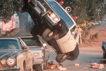 Cop car flipping over
